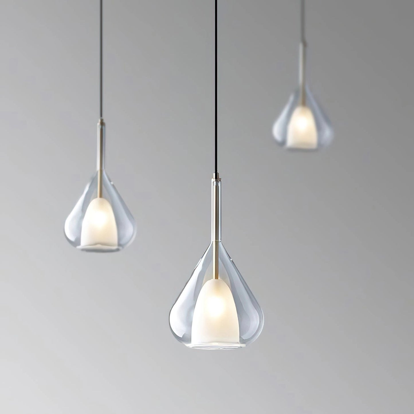 Nordic style pendant lamp with clear raindrop design and starlight effect, featuring a circular transparent glass shade and metal ceiling fixture.