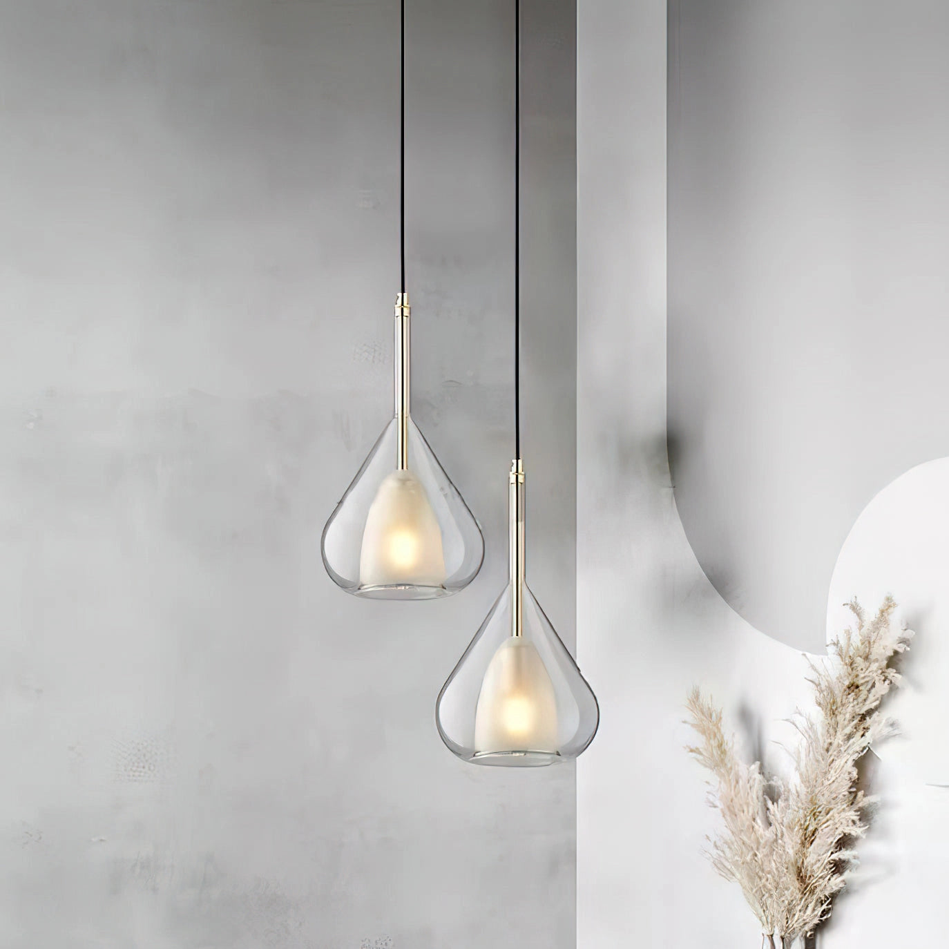 Nordic style pendant lamp with a clear raindrop design and starlight effect, featuring a grey tint and a light bulb, hanging from a twig-like structure.