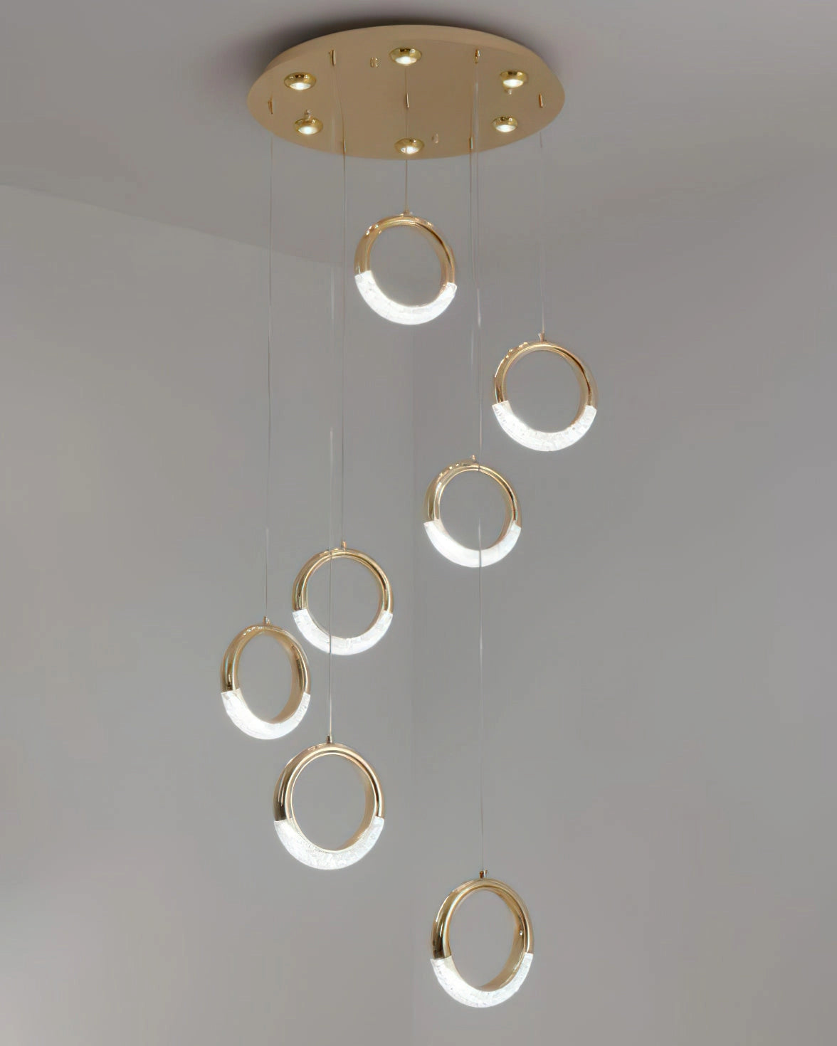 Modern Pendant Lamp Dante chandelier with a sleek metal design, circular ceiling fixture, and a contemporary aesthetic.