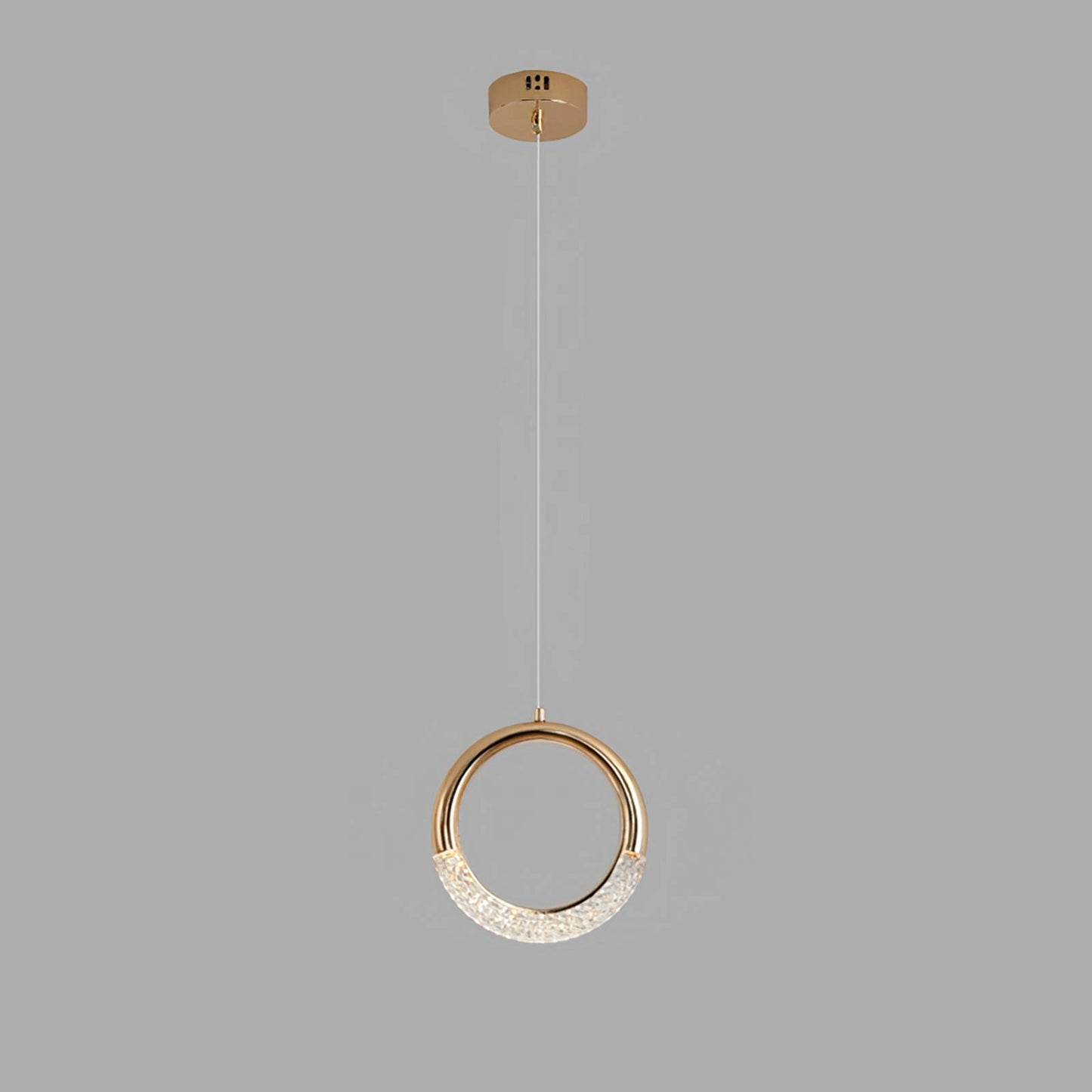 Modern gold pendant lamp chandelier with multiple circular heads, suspended from the ceiling, emitting cool light.