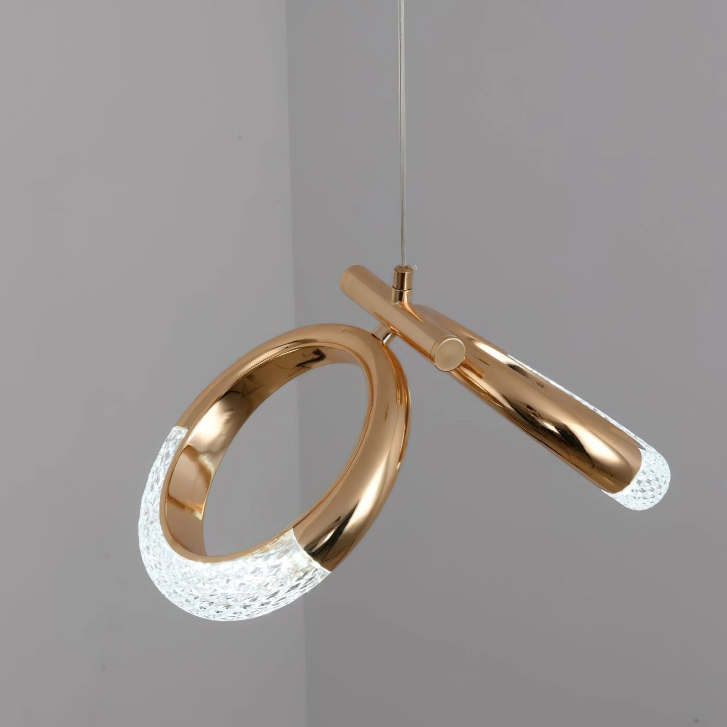 Modern gold and wood Pendant Lamp Dante chandelier with geometric shapes including rectangles, circles, and ovals.