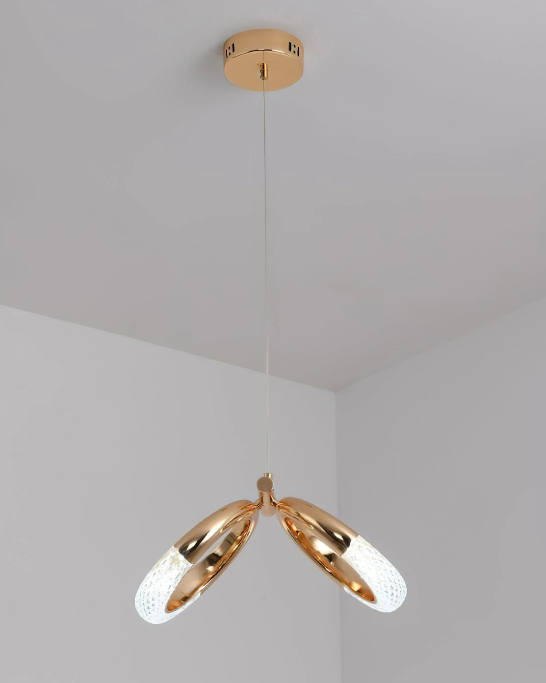 Modern Pendant Lamp Dante chandelier with a circular beige wooden design, featuring metal accents, suspended from the ceiling.