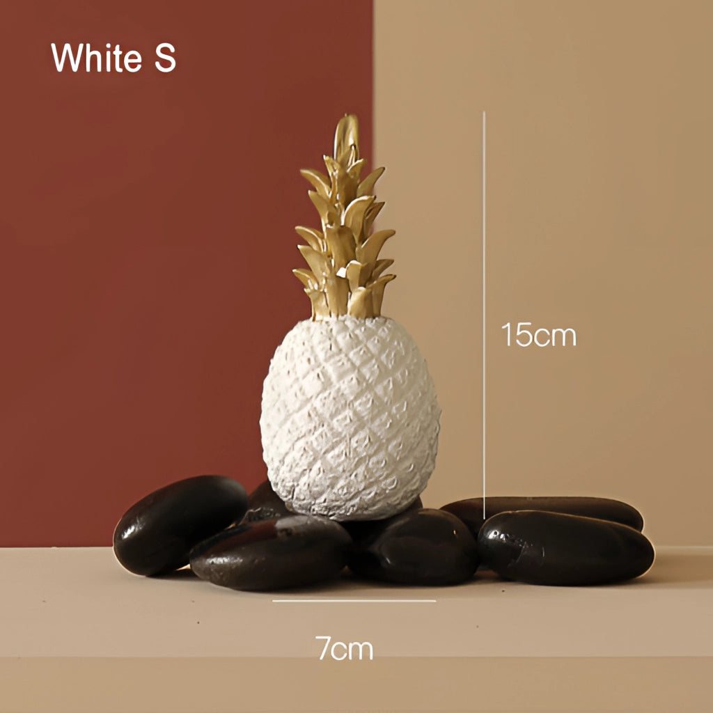 Golden resin ornament shaped like a pineapple, small size in white, used as Nordic home decor.