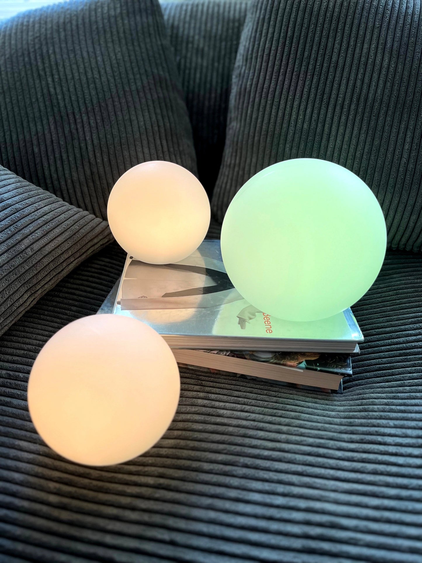 Rechargeable Cordless LED Moon Table Lamp with 16 Color Options on a wooden table.