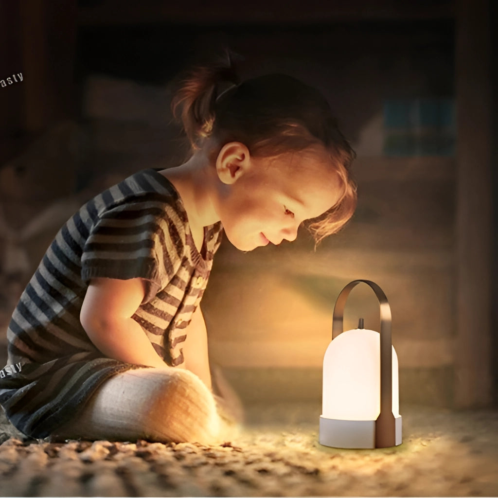 Rechargeable table lamp with touch dimming feature on a wooden surface, shown in a dimly lit environment.