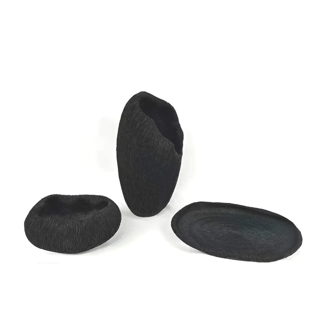 A resin nature-inspired decorative bowl with a unique design, featuring intricate details and a smooth finish.