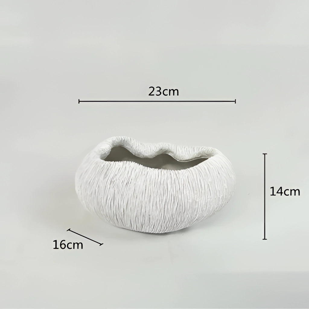 A resin nature-inspired decorative bowl with intricate details and artistic design.