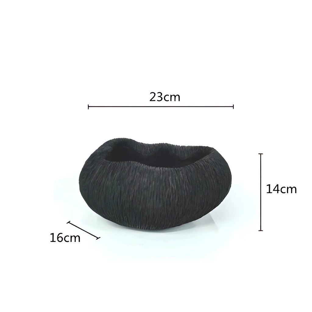 Resin Nature-Inspired Decorative Bowl with intricate details in variant E, displayed next to a human model wearing a cap and eyewear.