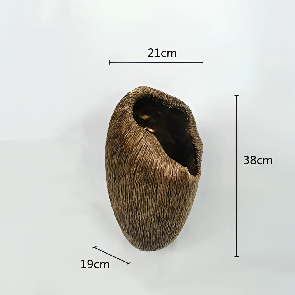 A resin nature-inspired decorative bowl featuring intricate designs resembling plants and trees, with a circular shape and artistic wood-like patterns.