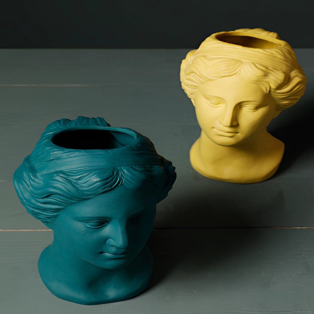 Resin Neoclassical Venus Vase in Blush Pink featuring a detailed sculpture of Venus' head and shoulders, showcasing intricate forehead, chin, and jawline details with an artistic and collectible quality.