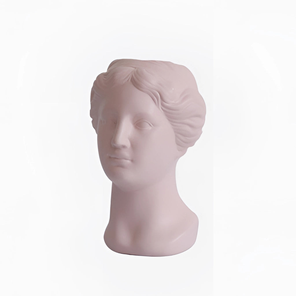 Blush pink neoclassical Venus vase made of resin, featuring detailed craftsmanship and artistic design.