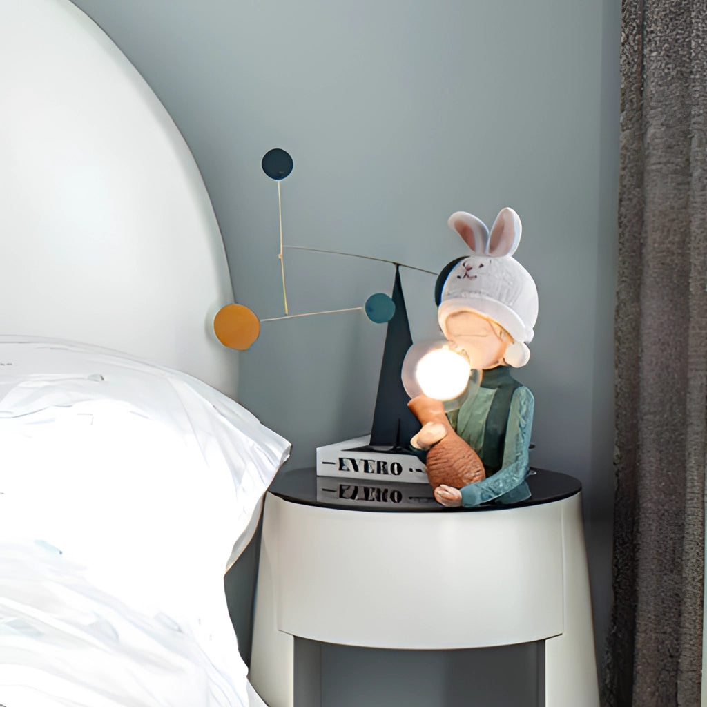 Resin table lamp featuring an elegant rabbit girl design with dual glass lampshades, suitable for room decor.