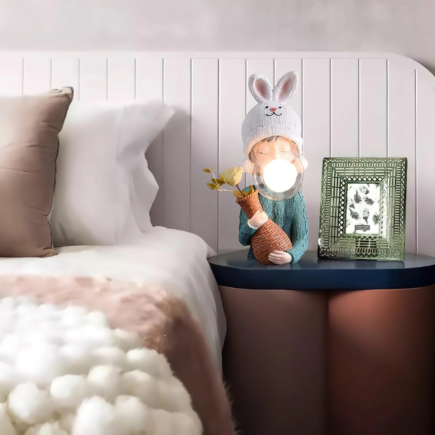 Resin table lamp featuring an elegant rabbit girl with a dual glass lampshade, positioned in a cozy room setting.