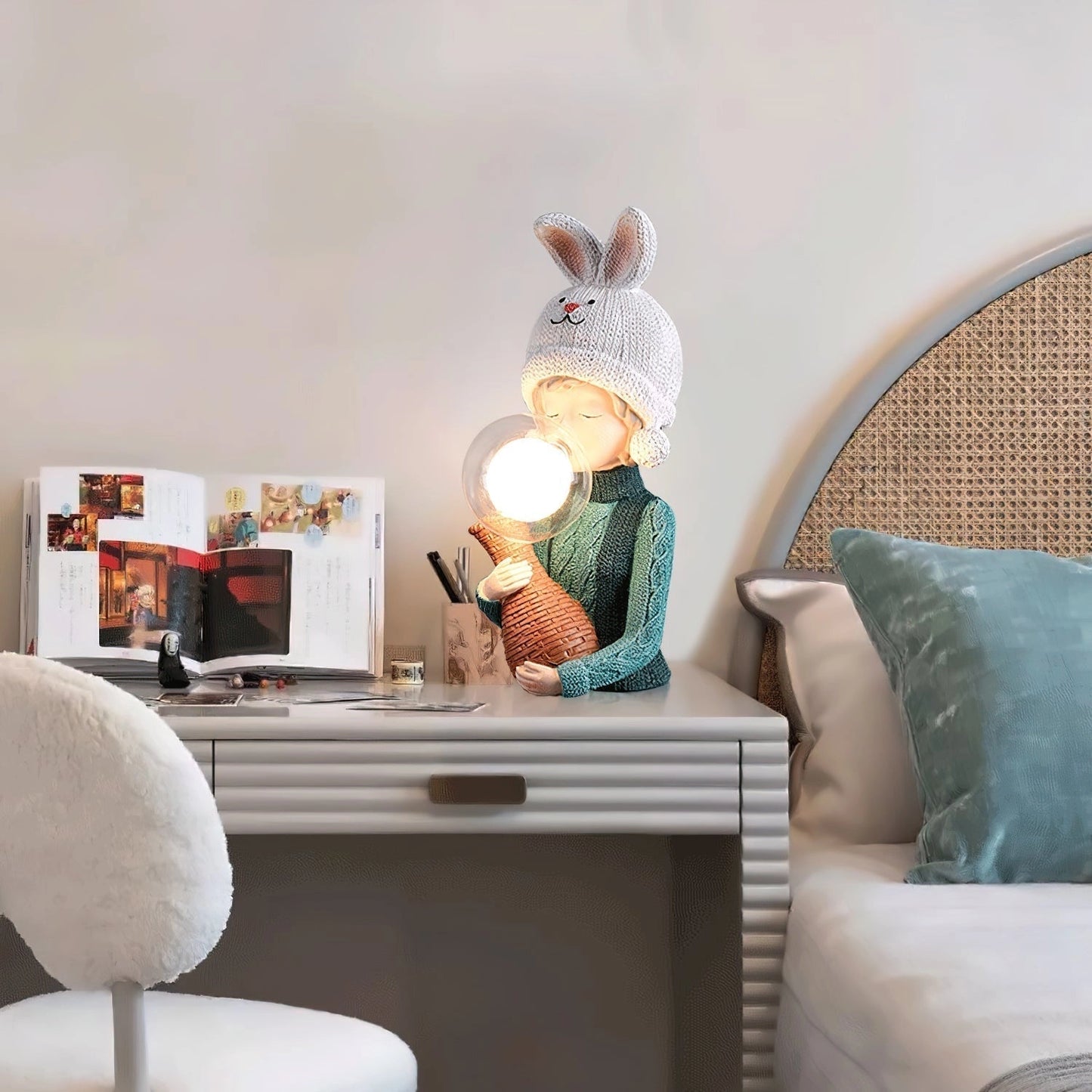 Resin table lamp featuring an elegant rabbit girl design with dual glass lampshades on a wooden table in a cozy interior setting.