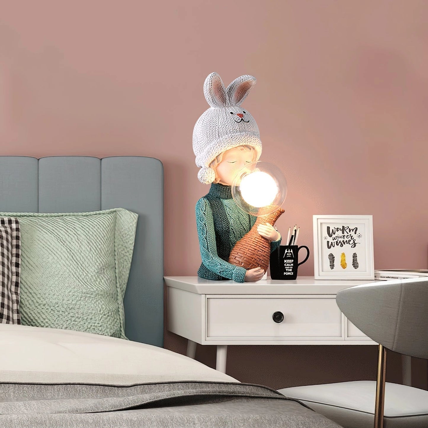 A decorative resin table lamp featuring a charming rabbit girl figure, dual glass lampshades, and a grey rectangular wooden base, perfect for adding a touch of elegance and comfort to interior design settings.