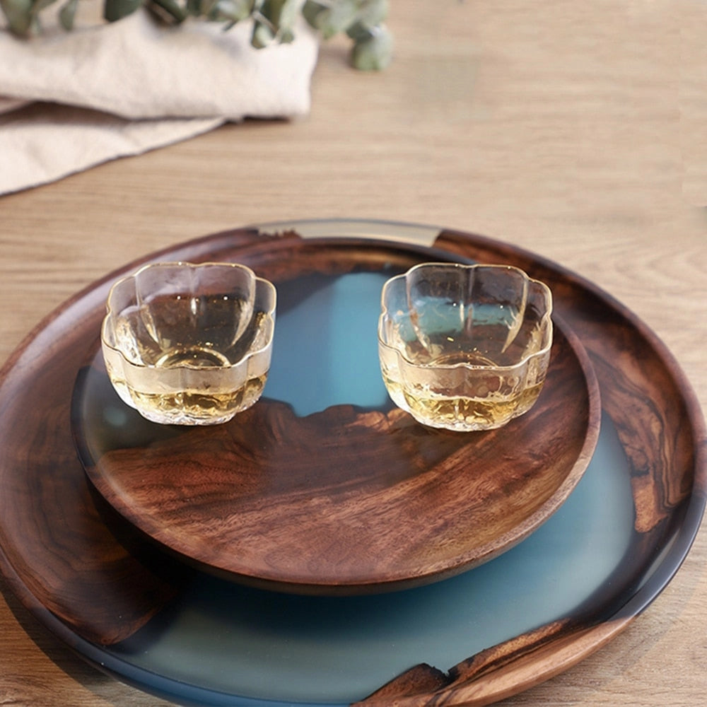 Handcrafted rectangular resin wood tray with natural wood and epoxy resin, ideal for serving food and drinks.