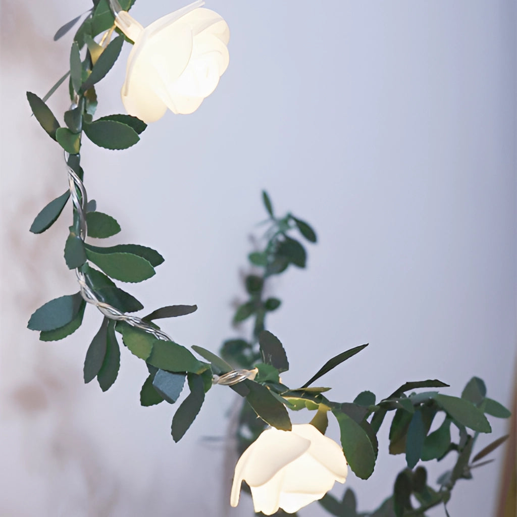 Battery-operated LED garland with rose flower string lights featuring realistic petals and branches.
