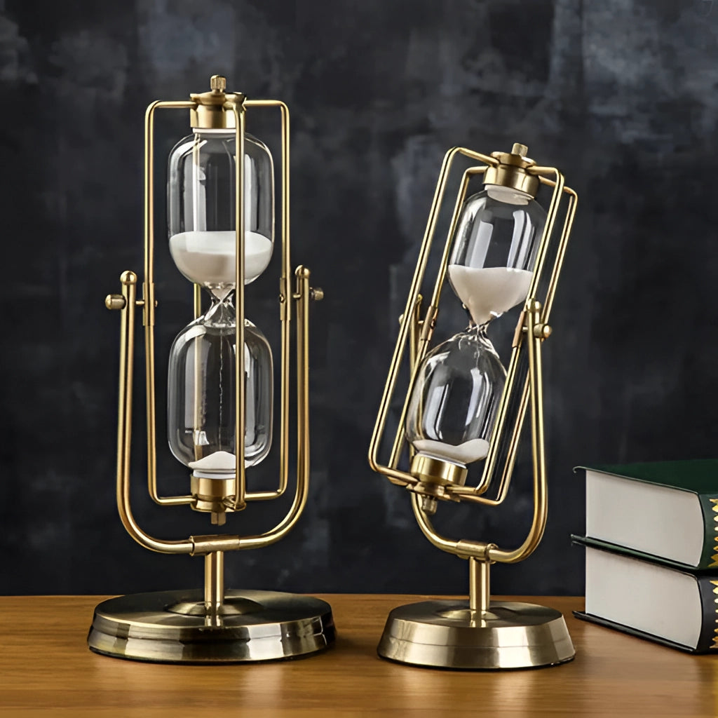 An elegant rotating globe hourglass timer with a brass frame, featuring yellow sand. The sand clock is placed in a room, photographed in a still life arrangement.