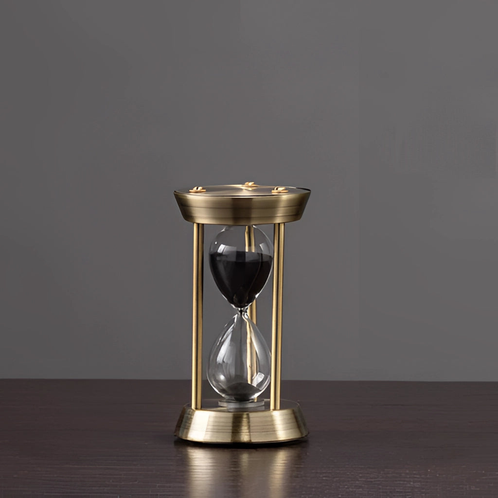 Elegant Rotating Globe Hourglass Timer with 10-minute sand timer, featuring a sleek glass cylinder design, measuring 6.5 by 12 centimeters, placed on a table with metal accents.