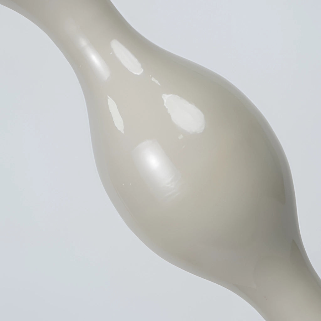 A Scandinavian LED floor lamp with adjustable brightness and a Nordic design, featuring a sleek metal and wood construction.