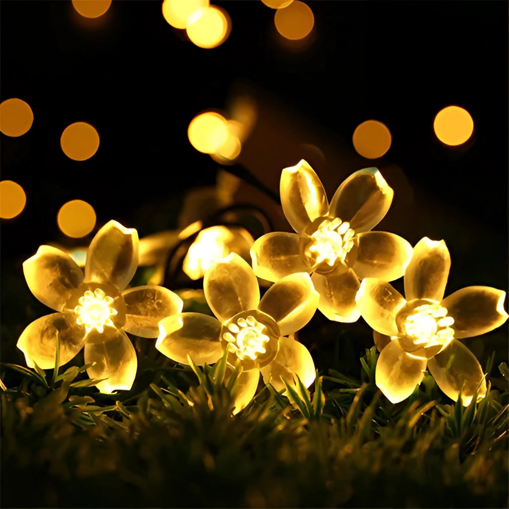 Solar Flower Garden LED Light Strips in cherry warm color, featuring illuminated flower petals and leaves arranged in a decorative pattern.
