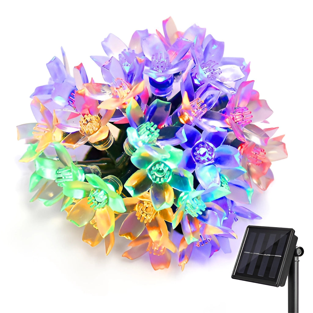Solar Flower Garden LED Light Strips illuminating vibrant artificial flowers and petals arranged creatively in a garden setting.