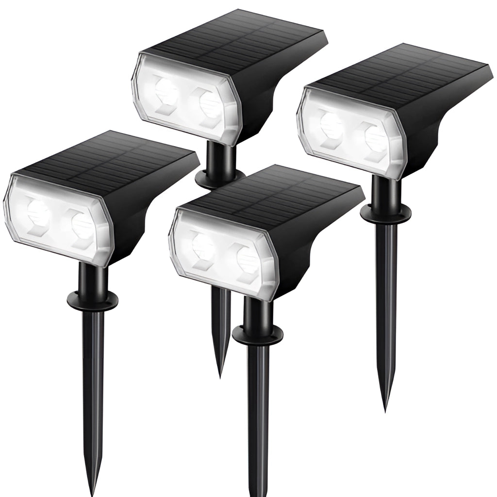 Four white solar landscape spotlights with IP65 waterproof rating, featuring long battery life, suitable for outdoor use.