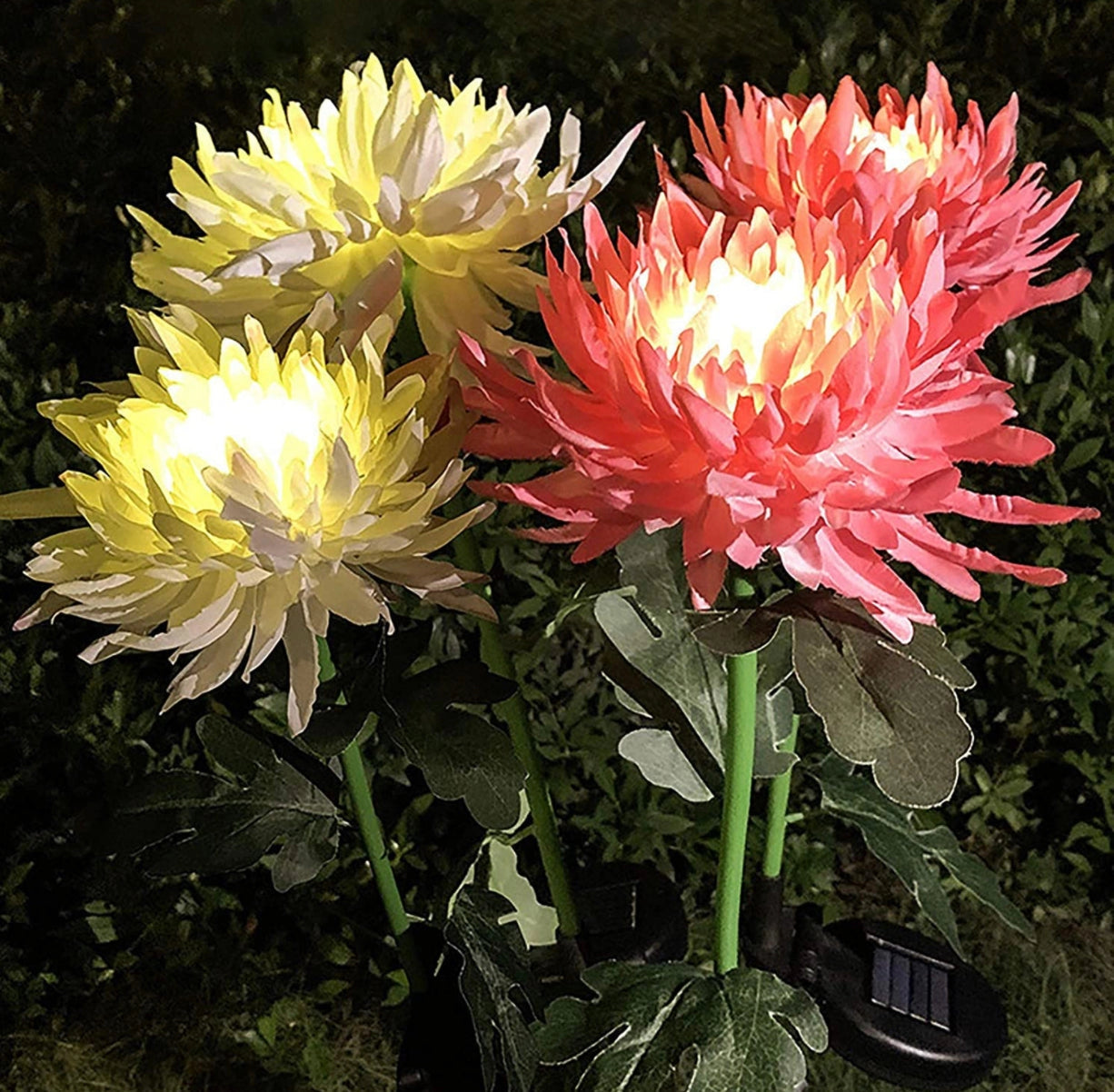 Solar LED Crown Imperial Flower Lights illuminating a garden with bright, vibrant yellow petals and green foliage.