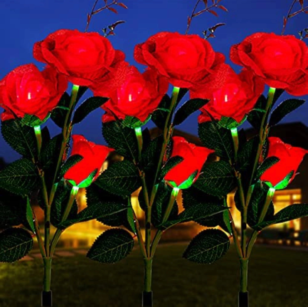 Twin pack of solar-powered LED rose lights in white, featuring lifelike red roses with detailed petals and leaves, perfect for nighttime garden decor.