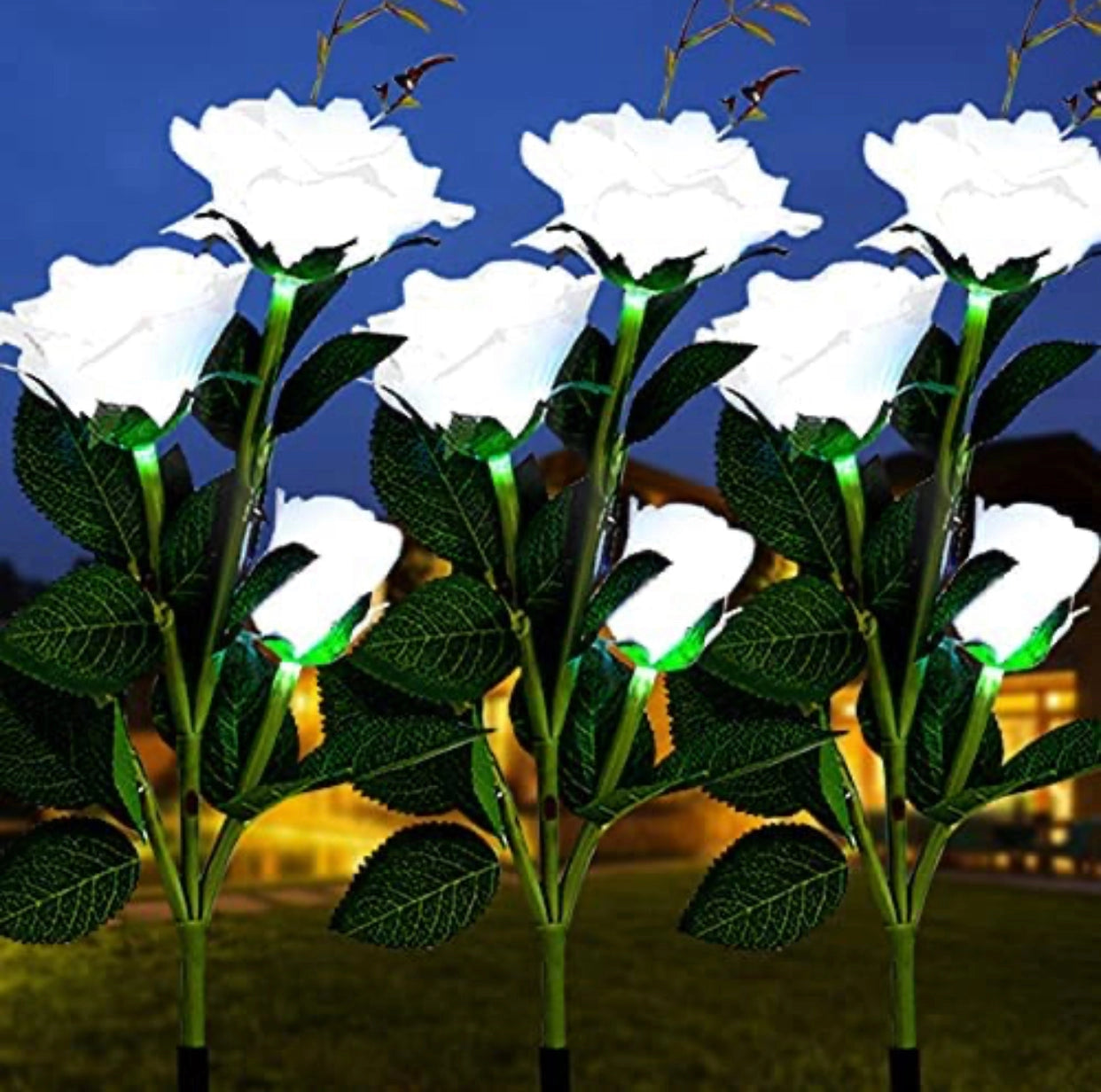 Twin pack of white solar LED rose lights with realistic petals and leaves, designed for nightlight garden decor.