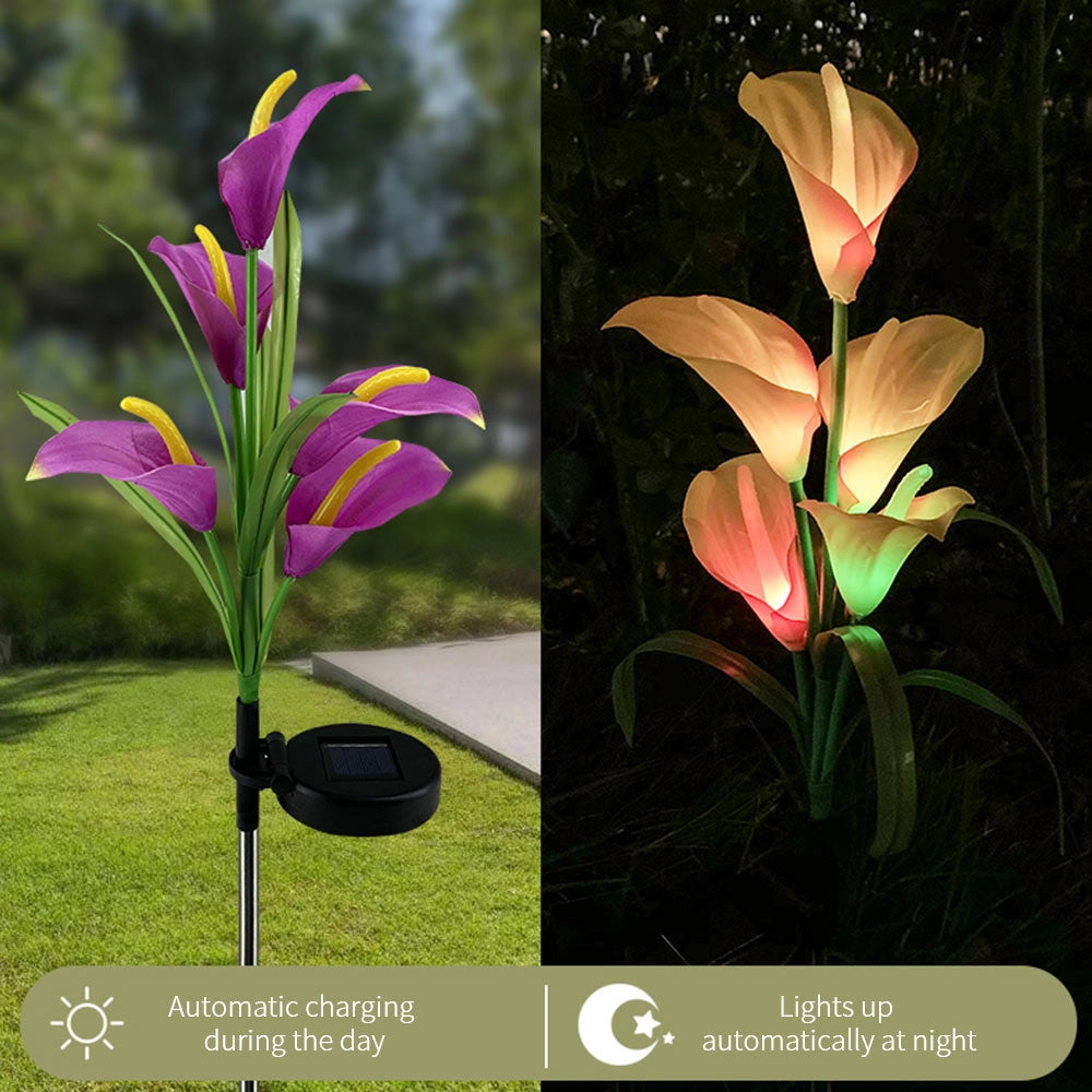 Set of 4 Solar Lily Garden Lights with multi-color LEDs illuminating a garden, resembling vibrant lilies with detailed petals and leaves among surrounding plants and flowers.