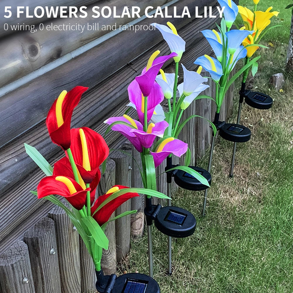 Set of 4 Solar Lily Garden Lights with multi-color LEDs in white, red, yellow, and purple, displayed in a garden setting among grass and plants.