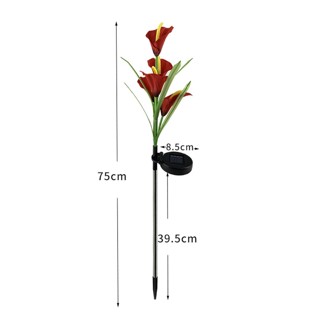 Set of 4 solar lily garden lights with multi-color LEDs illuminating a garden with lifelike flower designs.