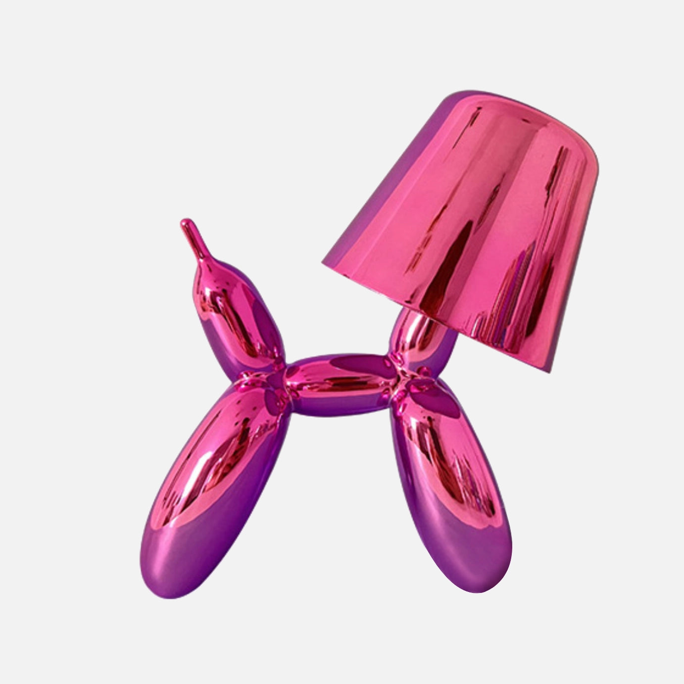 A pink table lamp with a touch-sensitive, dimmable crystal base and a balloon dog design.