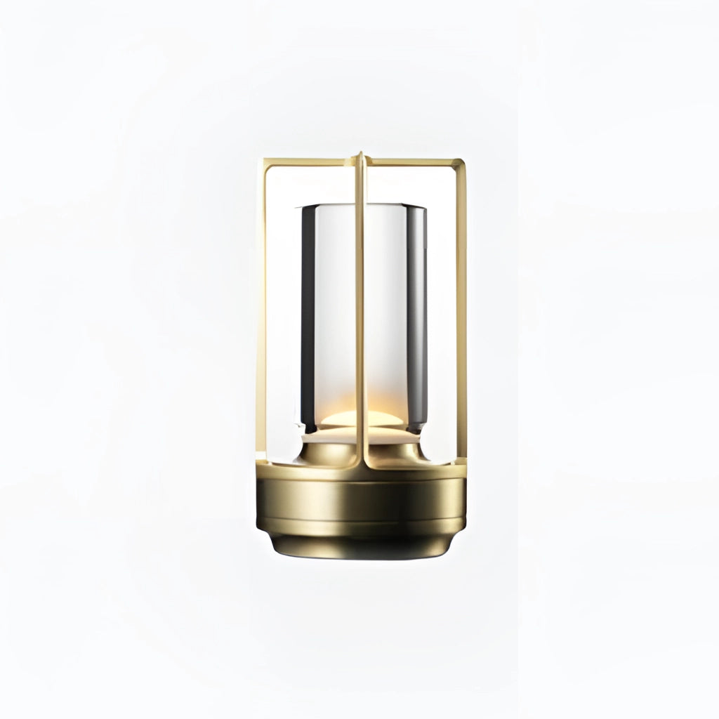 Gold rectangular table lamp with dimming feature, wooden base, cylindrical glass shade, and metal accents resembling a lantern.