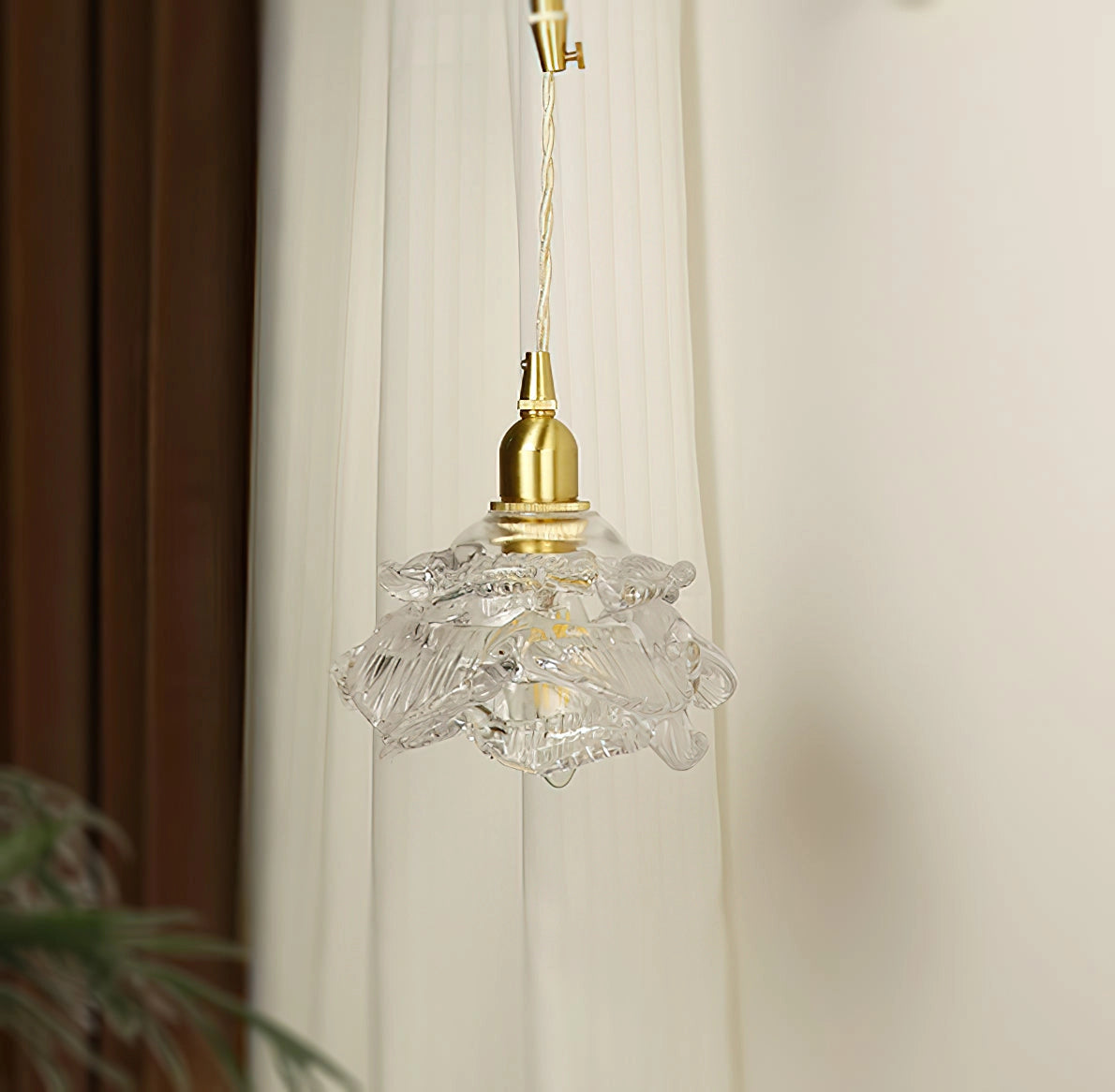 Elegant Vintage Brass Wall Light with Rose Glass Shade mounted on wall, surrounded by festive holiday decor.