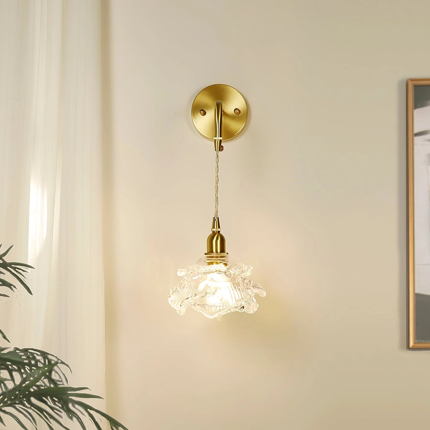 Vintage brass wall light with rose glass shade mounted on a wooden wall; elegant wall sconce with a blend of metal and natural materials in a sophisticated interior design setting.