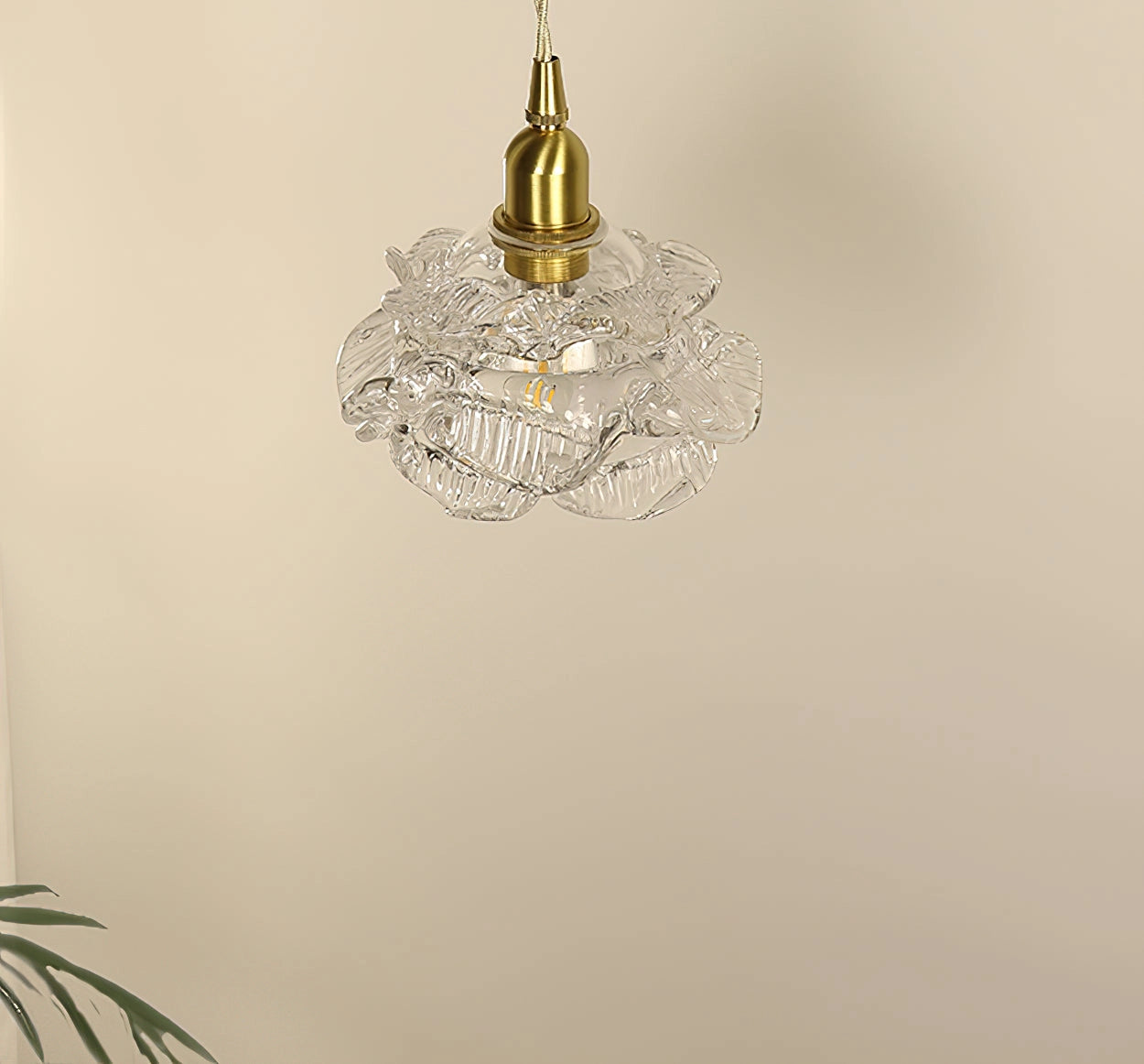 Vintage Brass Wall Light with Rose Glass Shade featuring elegant design and intricate detailing, mounted on a wall.