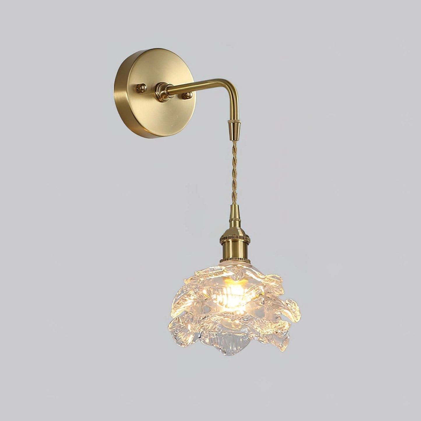 Vintage brass wall light with rose glass shade, elegant wall sconce, set of 2, displayed against a wooden background.