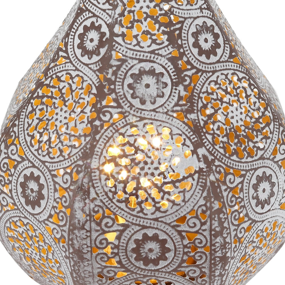 Vintage Moroccan metal lantern with intricate symmetrical patterns and yellow accents, designed as a decorative art piece with battery power.