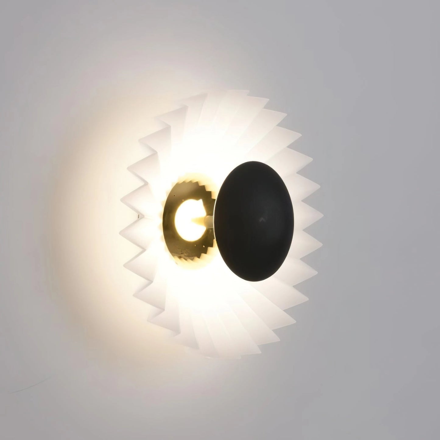 Modern wall lamp with artistic design and premium materials, featuring a circular light fixture set against a cloudy sky background.