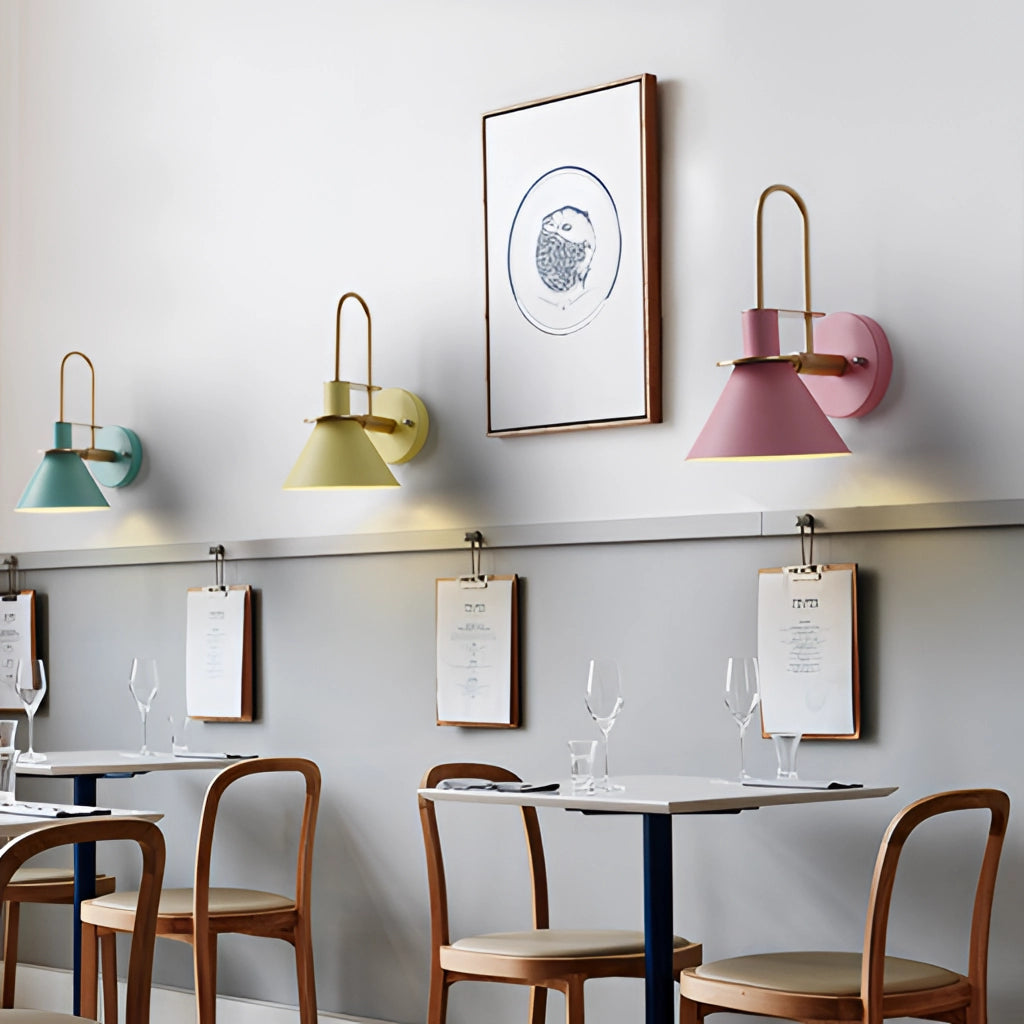 Elegant retro design wall light with a matte finish, mounted on an interior wall, illuminating a room with modern furniture and decor, including a table, shelving, and chairs in white and wood tones.