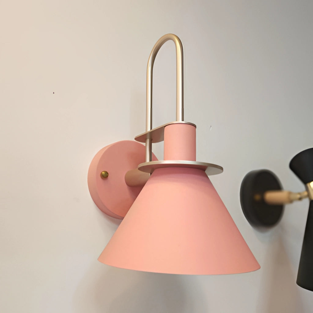 Elegant retro design wall light with a matt pink finish, featuring a circular light fixture, suitable for interior settings.