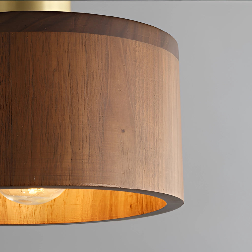 Walnut wood pendant lamp with Japanese woodworking inspiration, featuring a cylindrical shade and hardwood finish, hanging as a ceiling fixture.