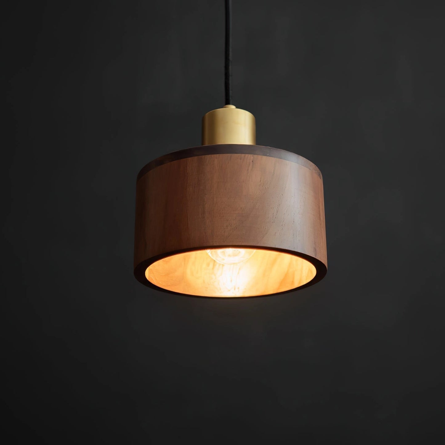 Walnut wood pendant lamp with Japanese woodworking design, hanging from the ceiling, emitting warm light, and featuring metal accents.