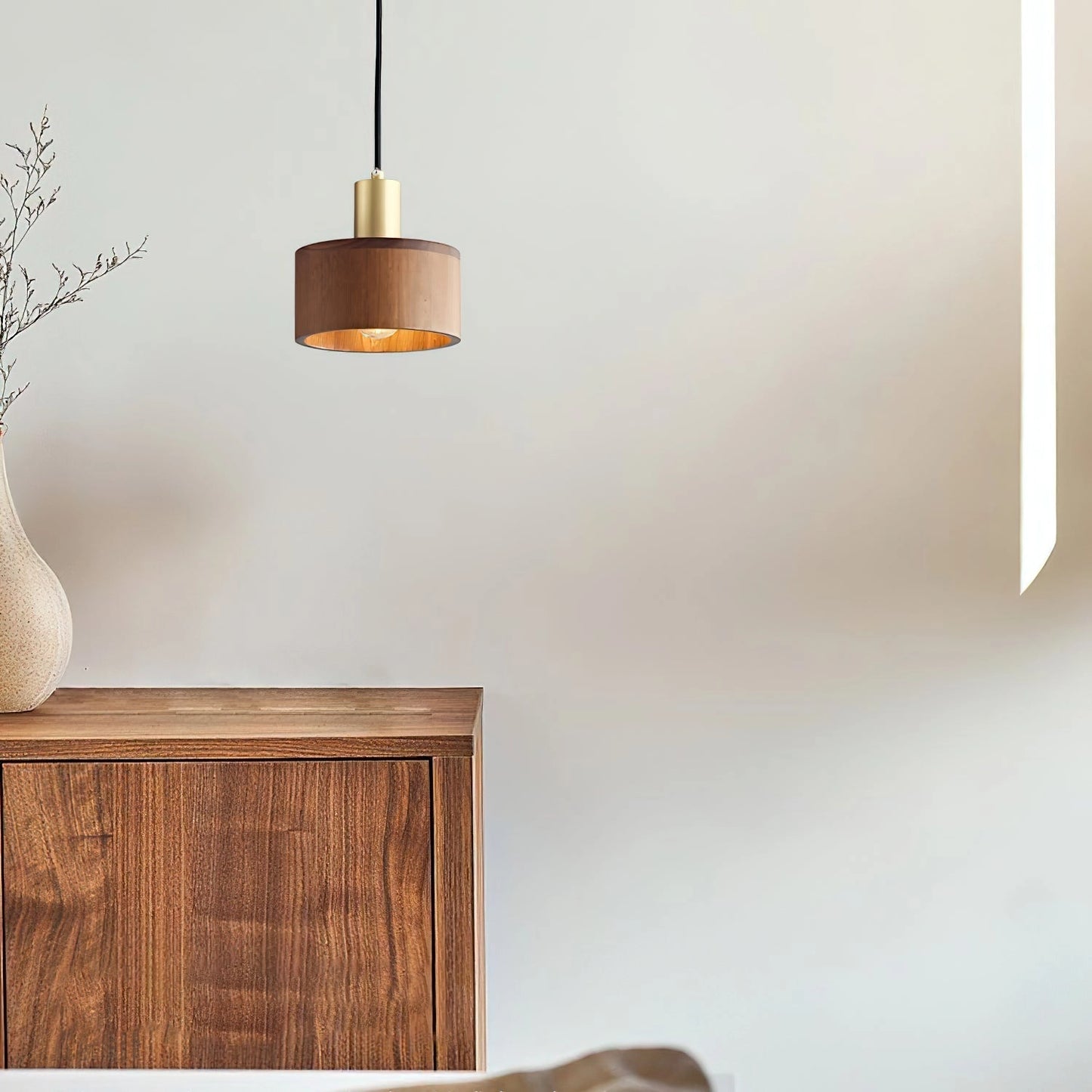 Walnut wood pendant lamp inspired by Japanese woodworking, featuring a rectangular hardwood design with a stained wood finish, hanging from the ceiling.