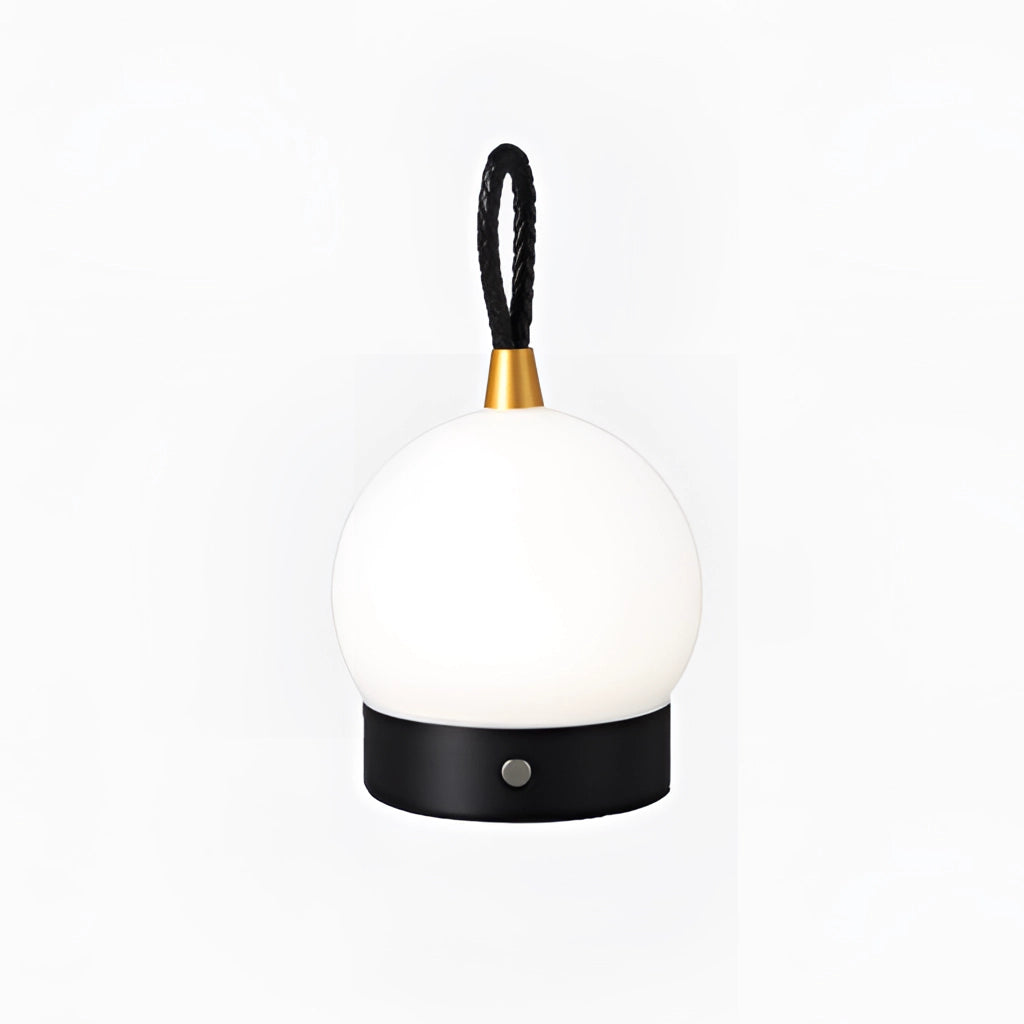 Black Waterproof LED Table Lamp with Cordless Orb Design on a table.