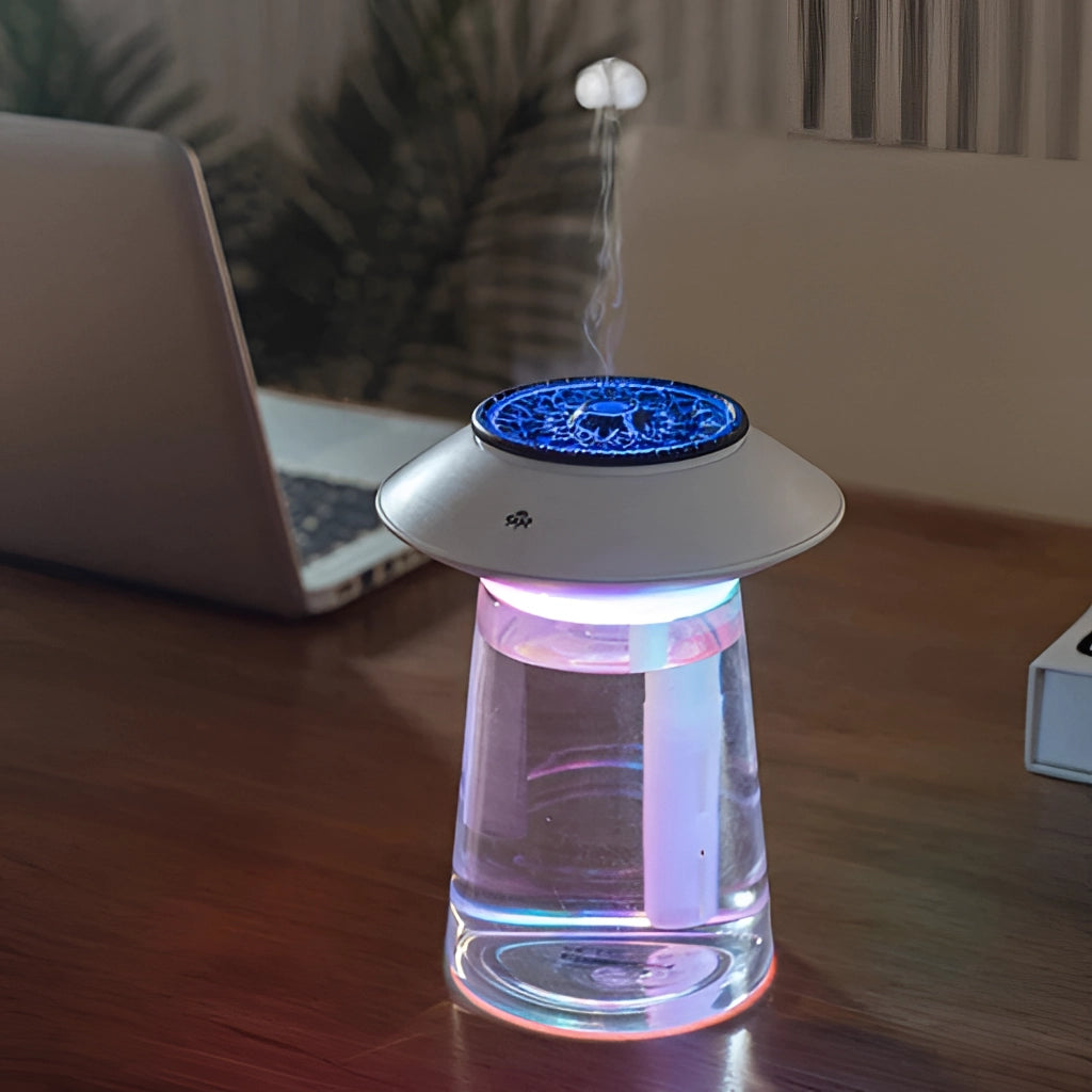 760ml USB Rechargeable Ultrasonic Mist Maker on a table near a laptop.