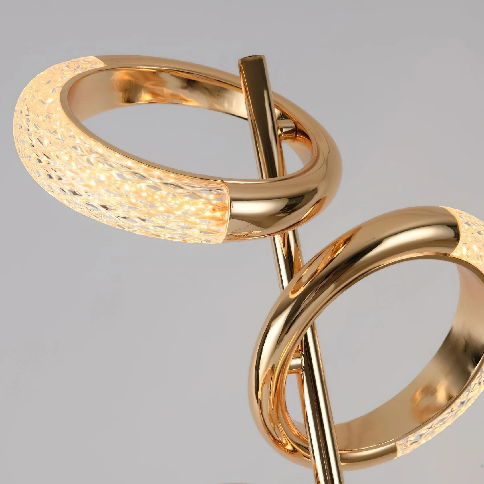Adjustable Nordic style wall lamp with rotatable design featuring a sleek gold finish, mounted on a wooden base.