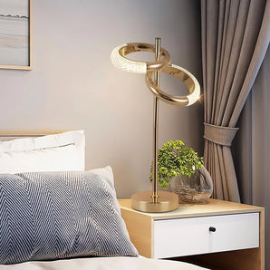 Adjustable Nordic Style Wall Lamp with Rotatable Design mounted on a wooden wall, illuminating a nearby table with a plant on it, showcasing a modern interior design setting.